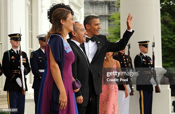 President Barack Obama and first lady Michelle Obama welcome Mexican President Felipe Calderon and first lady Margarita Zavala on the North Portico...