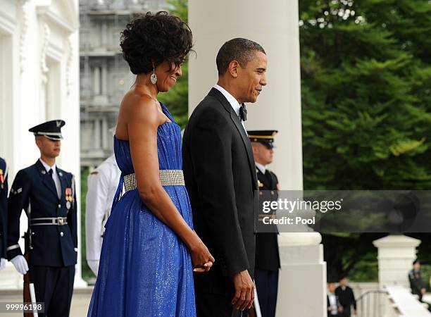 President Barack Obama and first lady Michelle Obama wait to welcome Mexican President Felipe Calderon and first lady Margarita Zavala on the North...