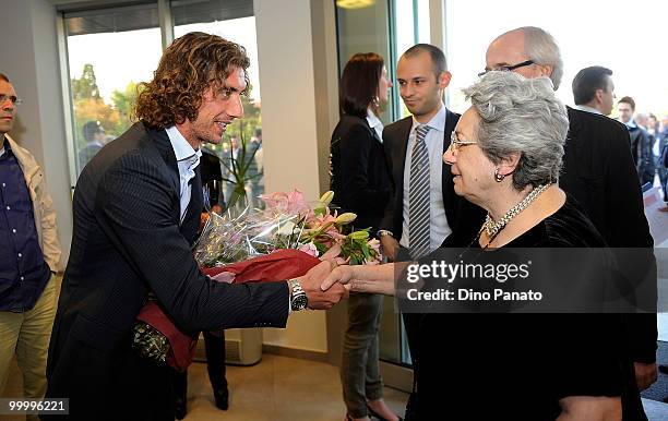 Paolo Castellini of Parma greets Franca Bertacchini as they attend a press conference as Parma FC and Navigare announce the renewal of their...