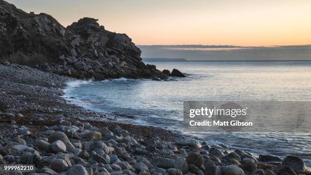 beautiful sunrise landscape image of church ope cove in portland - ope imagens e fotografias de stock