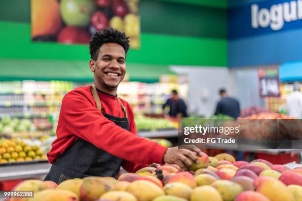 supermarket worker portrait - supermarket staff stock pictures, royalty-free photos & images