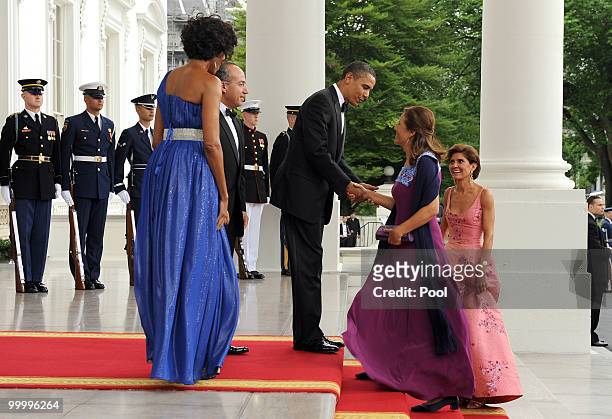President Barack Obama greets Mexican first lady Margarita Zavala as he and first lady Michelle Obama welcome Mexican President Felipe Calderon and...