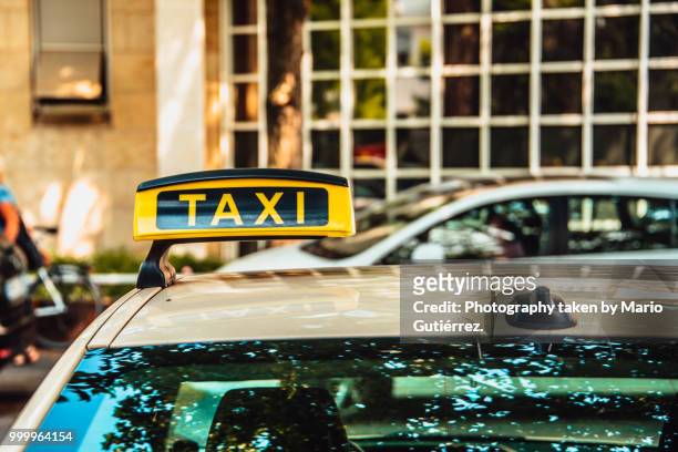 detail of taxi sign - taxi sign stock pictures, royalty-free photos & images