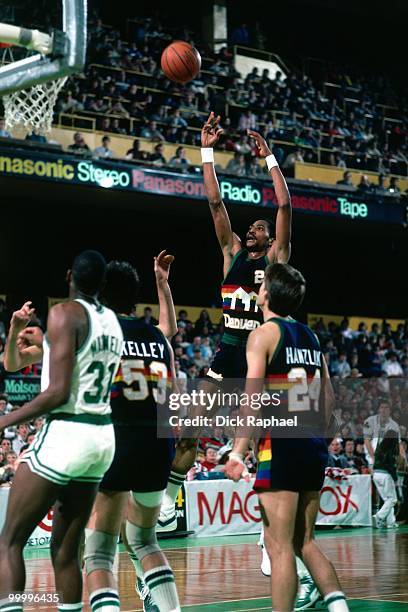 Alex English of the Denver Nuggets shoots a jumper against the Boston Celtics during a game played in 1983 at the Boston Garden in Boston,...