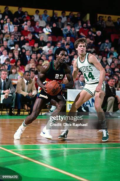 Dunn of the Denver Nuggets makes a move to the basket against Danny Ainge of the Boston Celtics during a game played in 1983 at the Boston Garden in...