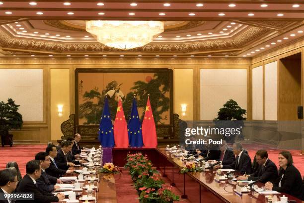 European Council President Donald Tusk and European Commission President Jean-Claude Juncker at right meets with Chinese Premier Li Keqiang at left...