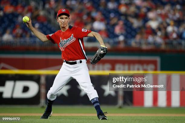 Bill Nye makes a throw during the All-Star and Legends Celebrity Softball Game at Nationals Park on July 15, 2018 in Washington, DC.