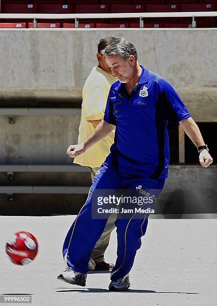 Governor of Jalisco Emilio Gonzalez plays with a ball during a visit to the construction of new Chivas Guadalajara stadium on May 19, 2010 in...