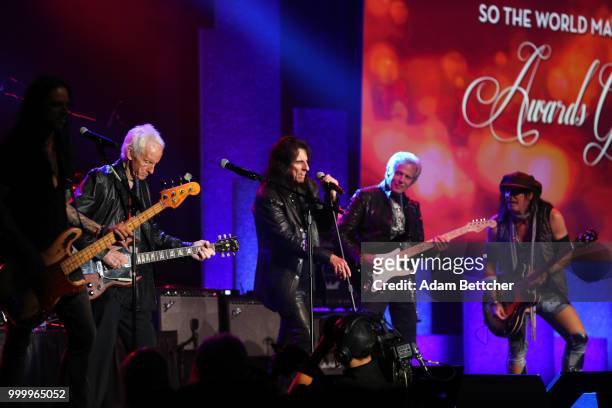 Robby Krieger, Alice Cooper, Don Felder and Ryan Roxie perform at the 2018 So the World May Hear Awards Gala benefitting Starkey Hearing Foundation...