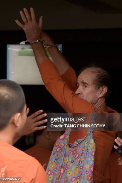 Detained Australian filmmaker James Ricketson arrives in Phnom Penh court for his continuing trial on July 16, 2018. - Ricketson was arrested in...