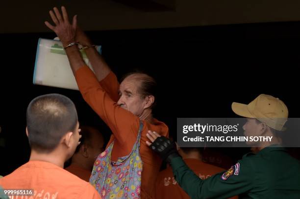 Detained Australian filmmaker James Ricketson arrives in Phnom Penh court for his continuing trial on July 16, 2018. - Ricketson was arrested in...