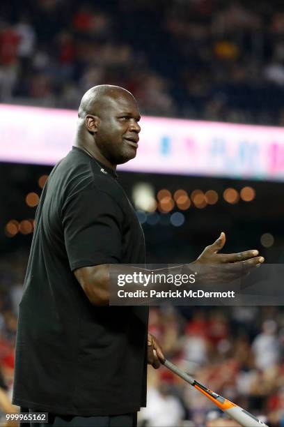 Shaquille O'Neal reacts as he bats during the All-Star and Legends Celebrity Softball Game at Nationals Park on July 15, 2018 in Washington, DC.