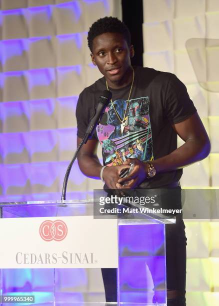 Honoree Victor Oladipo accepts an award onstage during the 33rd Annual Cedars-Sinai Sports Spectacular at The Compound on July 15, 2018 in Inglewood,...