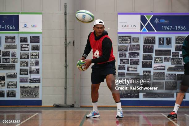 Seta Tamanivalu looks to pass the ball during a Crusaders Super Rugby training session at St Andrew's College on July 16, 2018 in Christchurch, New...