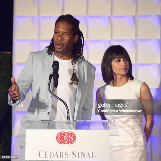 Granderson and Dr. Suzanne Devkota speak onstage during the 33rd Annual Cedars-Sinai Sports Spectacular at The Compound on July 15, 2018 in...