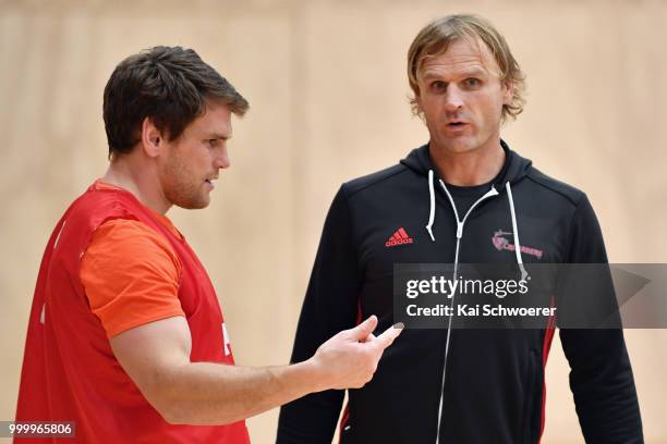 Matt Todd and Head Coach Scott Robertson look on during a Crusaders Super Rugby training session at St Andrew's College on July 16, 2018 in...