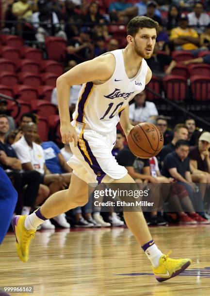 Sviatoslav Mykhailiuk of the Los Angeles Lakers brings the ball up the court against the Detroit Pistons during a quarterfinal game of the 2018 NBA...