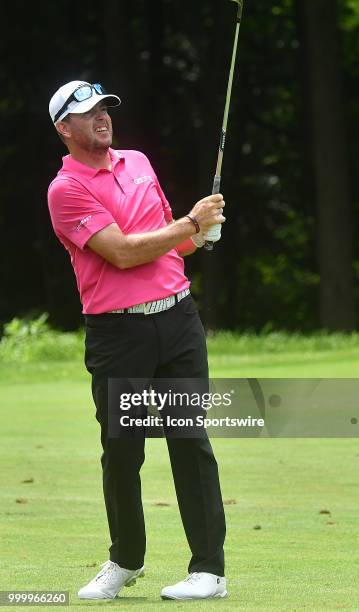 Robert Garrigus follows the progress of his second shot on the hole during the final round of the John Deere Classic on July 15 at TPC Deere Run,...