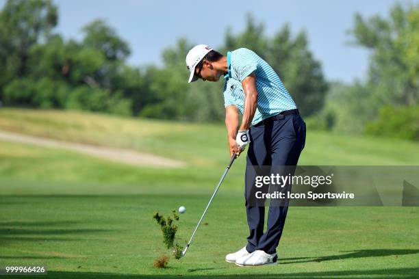 Michael Kim hits his approach shot on the 18th hole during the final round of the John Deere Classic on July 15, 2018 at the TPC Deere Run in Silvis,...