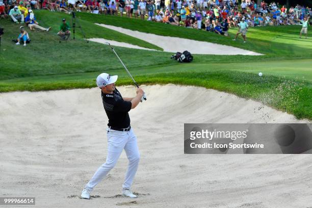 Bronson Burgoon hits a shot from the sand on the 18th hole during the final round of the John Deere Classic on July 15, 2018 at the TPC Deere Run in...
