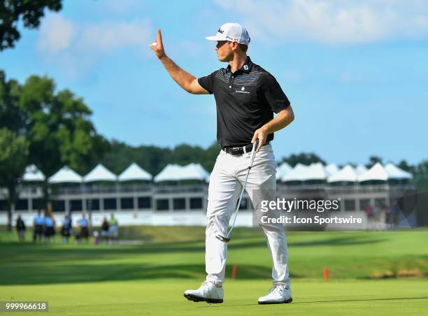 Bronson Burgoon waves to the crowd on the 18th hole after finishing the John Deere Classic on July 15, 2018 at the TPC Deere Run in Silvis, Illinois.
