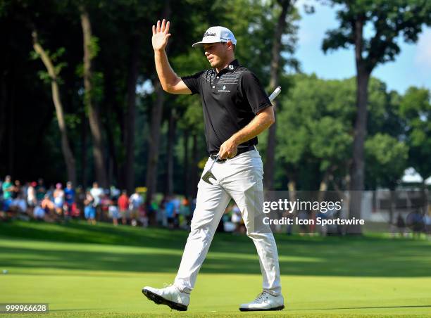 Bronson Burgoon celebrates on the 18th hole after finishing the John Deere Classic on July 15, 2018 at the TPC Deere Run in Silvis, Illinois.