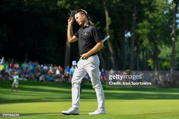 Bronson Burgoon tips his hat on the 18th hole after finishing the John Deere Classic on July 15, 2018 at the TPC Deere Run in Silvis, Illinois.