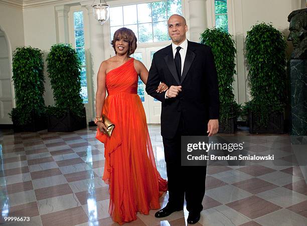 Gayle King and Cory Booker, Mayor of Newark, New Jersey, arrive at the White House for a state dinner May 19, 2010 in Washington, DC. President...