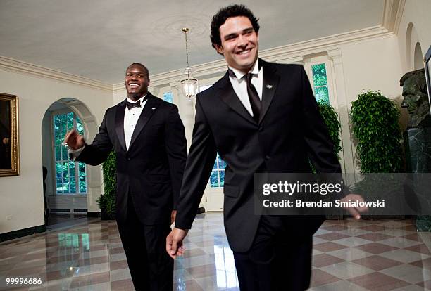 New York Jets players D'Brickashaw Ferguson and Mark Sanchez arrive at the White House for a state dinner May 19, 2010 in Washington, DC. President...