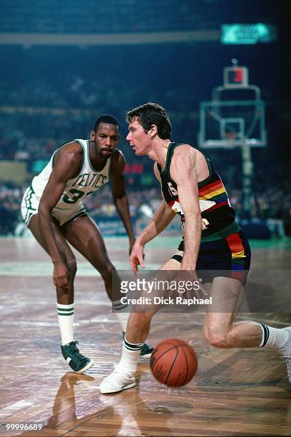 Kiki Vandeweghe of the Denver Nuggets makes a move against Cedric Maxwell of the Boston Celtics during a game played in 1983 at the Boston Garden in...