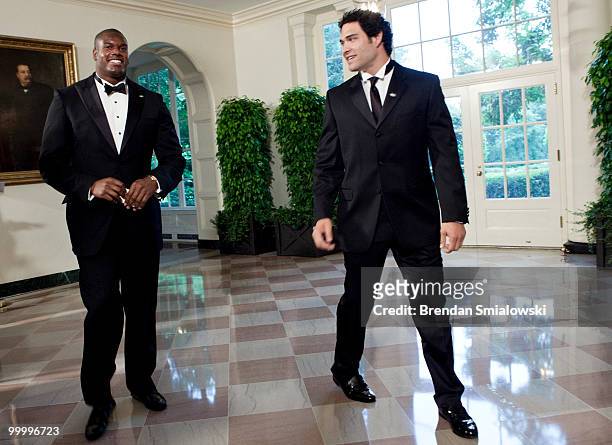 New York Jets players D'Brickashaw Ferguson and Mark Sanchez arrive at the White House for a state dinner May 19, 2010 in Washington, DC. President...