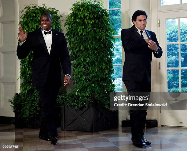 New York Jets players D'Brickashaw Ferguson and Mark Sanchez arrive at the White House for a state dinner May 19, 2010 in Washington, DC. President...