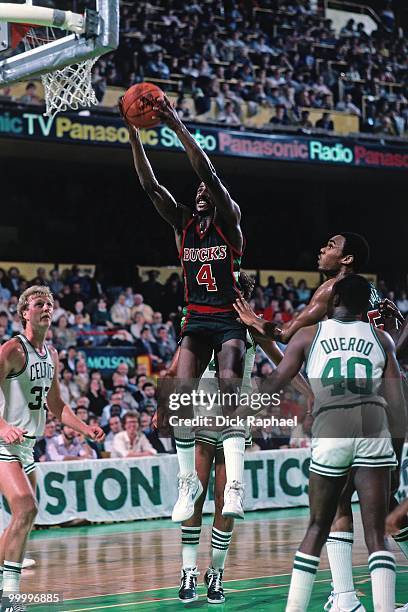 Sidney Moncrief of the Milwaukee Bucks rebounds against the Boston Celtics during a game played in 1983 at the Boston Garden in Boston,...