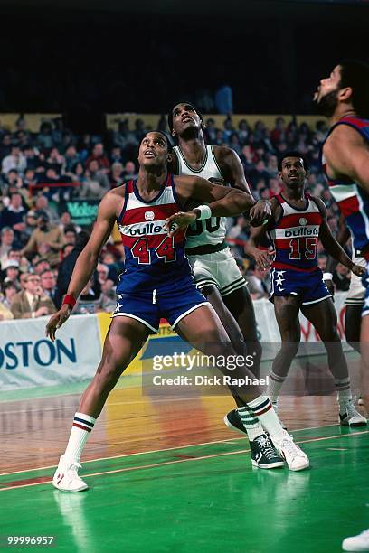 Rick Mahorn of the Washington Bullets boxes out against Robert Parish of the Boston Celtics during a game played in 1983 at the Boston Garden in...