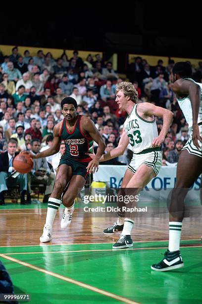 Marques Johnson of the Milwaukee Bucks drives to the basket against Larry Bird of the Boston Celtics during a game played in 1983 at the Boston...