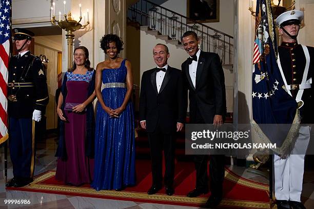 President Barack Obama, his wife Michelle Obama, Mexican President Felipe Calderon and his wife Margarita Zavala arrive to pose for pictures at the...