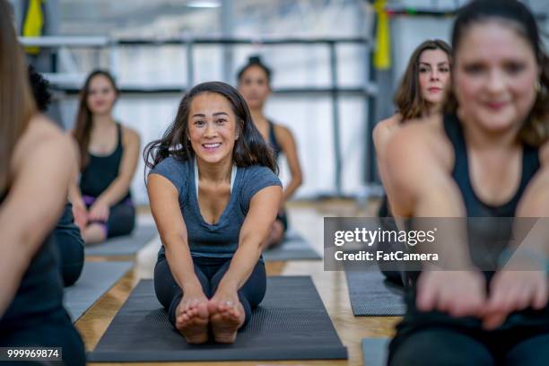stretching before workout - toe stock pictures, royalty-free photos & images