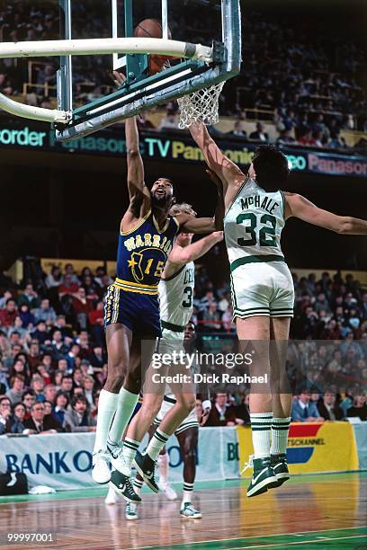 Lester Conner of the Golden State Warriors shoots a layup against Kevin McHale of the Boston Celtics during a game played in 1983 at the Boston...