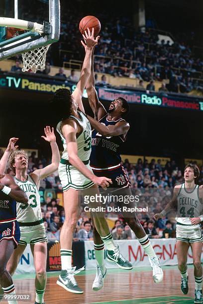Bill Cartwright of the New York Knicks shoots against Kevin McHale of the Boston Celtics during a game played in 1983 at the Boston Garden in Boston,...