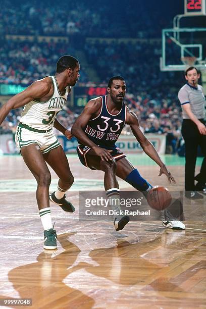 Sly Williams of the New York Knicks drives the ball up court against the Boston Celtics during a game played in 1983 at the Boston Garden in Boston,...