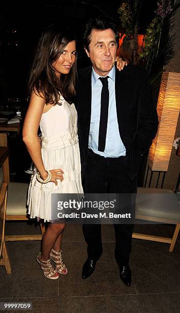 Amanda Sheperd and Bryan Ferry attend the launch party for the opening of TopShop's Knightsbridge store on May 19, 2010 in London, England.