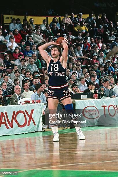 Ernie Grunfeld of the New York Knicks passes against the Boston Celtics during a game played in 1983 at the Boston Garden in Boston, Massachusetts....