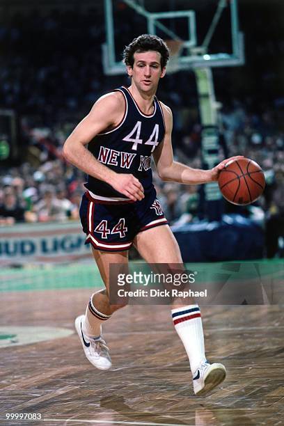 Paul Westphal of the New York Knicks moves the ball up court against the Boston Celtics during a game played in 1983 at the Boston Garden in Boston,...
