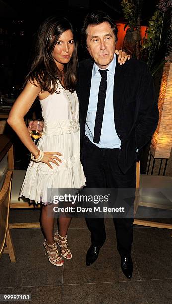 Amanda Sheperd and Bryan Ferry attend the launch party for the opening of TopShop's Knightsbridge store on May 19, 2010 in London, England.