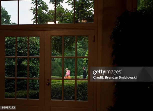 Guests walk through the South Lawn of the White House for a state dinner May 19, 2010 in Washington, DC. President Barack Obama and first lady...