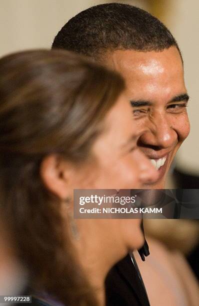 President Barack Obama and Mexican First Lady Margarita Zavala laugh during a state dinner at the White House in Washington on May 19, 2010. AFP...