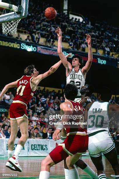 Kevin McHale of the Boston Celtics shoots over Steve Hayes of the Cleveland Cavaliers during a game played in 1983 at the Boston Garden in Boston,...