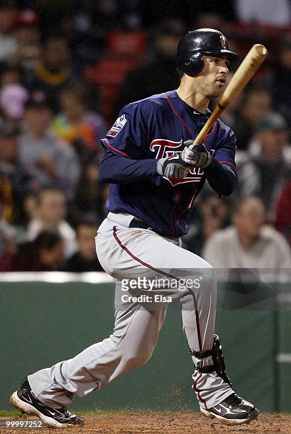 Joe Mauer of the Minnesota Twins gets an RBI double in the fourth inning against the Boston Red Sox on May 19, 2010 at Fenway Park in Boston,...