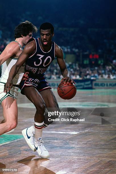 Bernard King of the New York Knicks makes a move to the basket against the Boston Celtics during a game played in 1983 at the Boston Garden in...