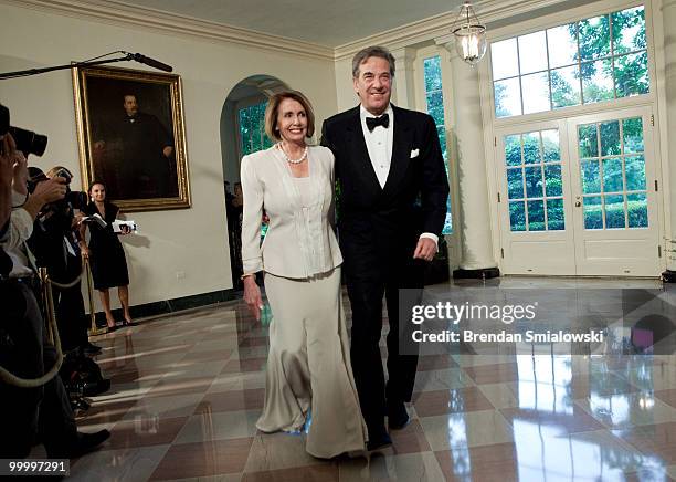 Speaker of the House Nancy Pelosi and husband Paul Pelosi arrive at the White House for a state dinner May 19, 2010 in Washington, DC. President...